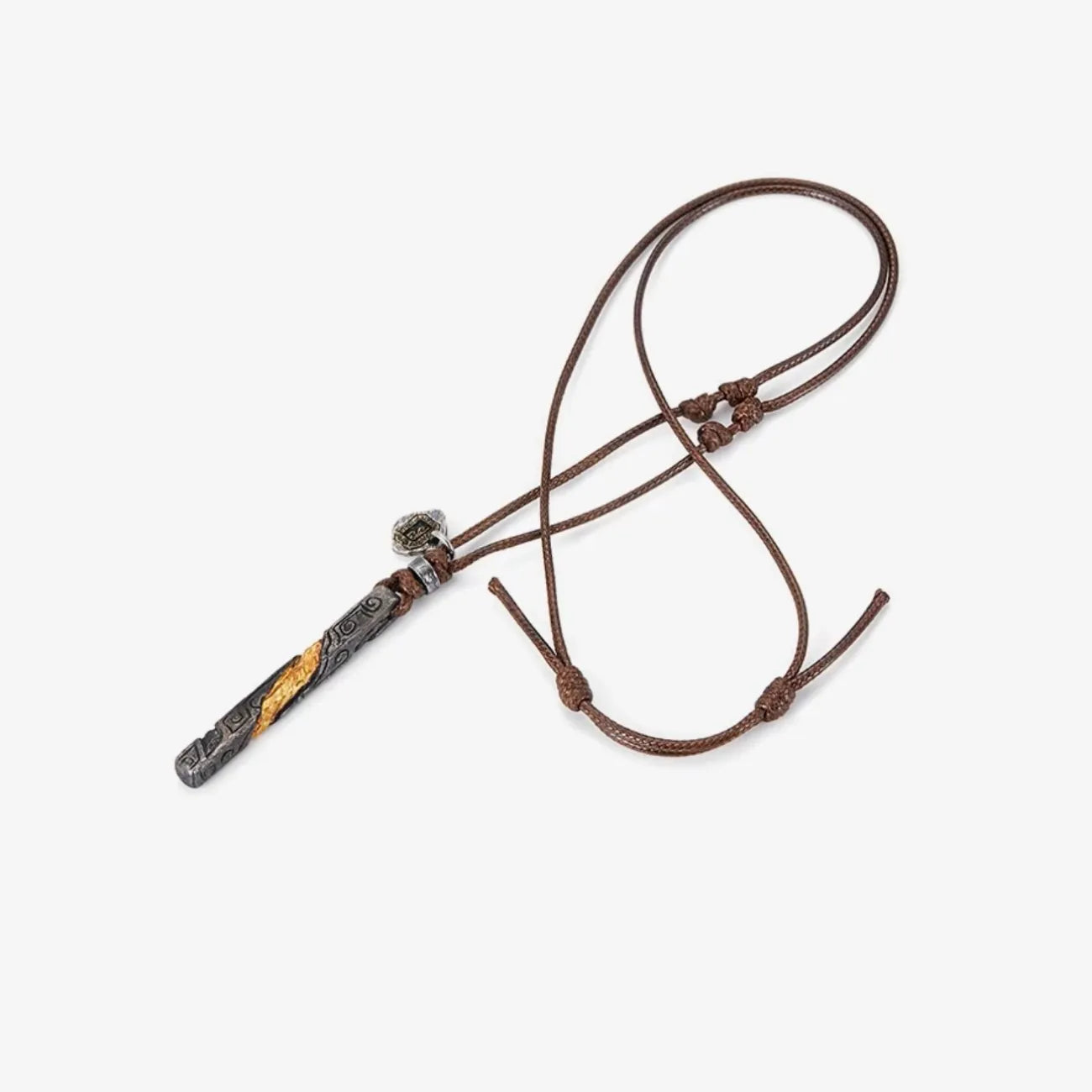 Flat lay of the 'Vital Flame' necklace featuring a twisted black silver pendant on a brown cord