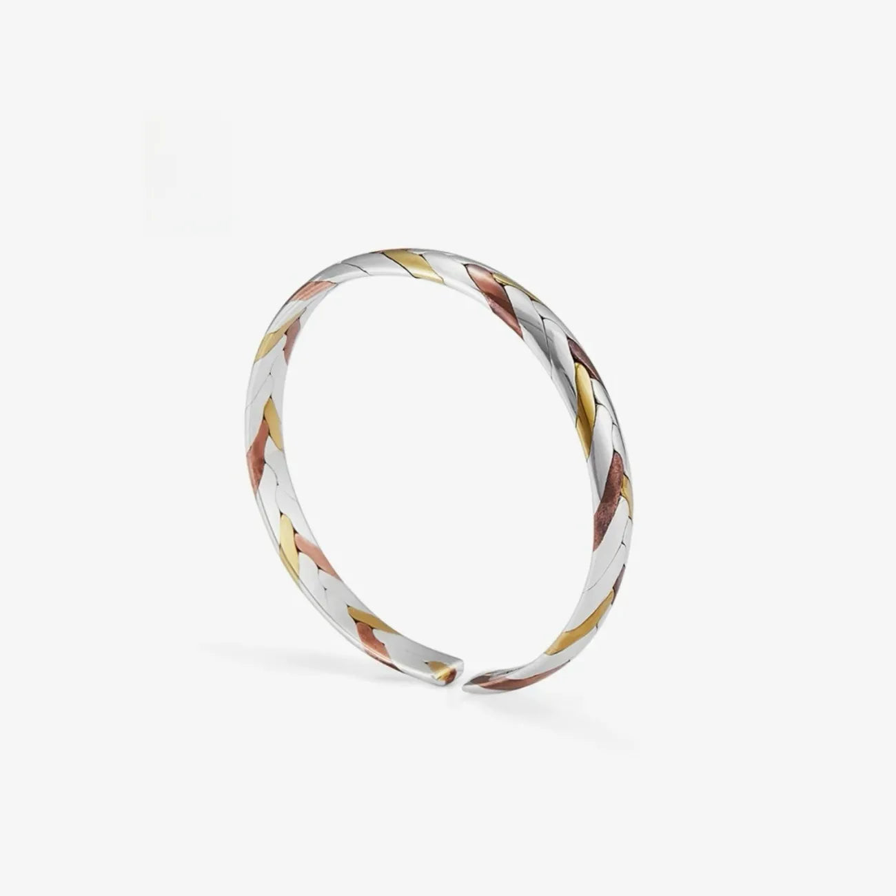 Top angle displaying the continuous braid pattern, highlighting the contrast between the cool silver and warm gold/red tones