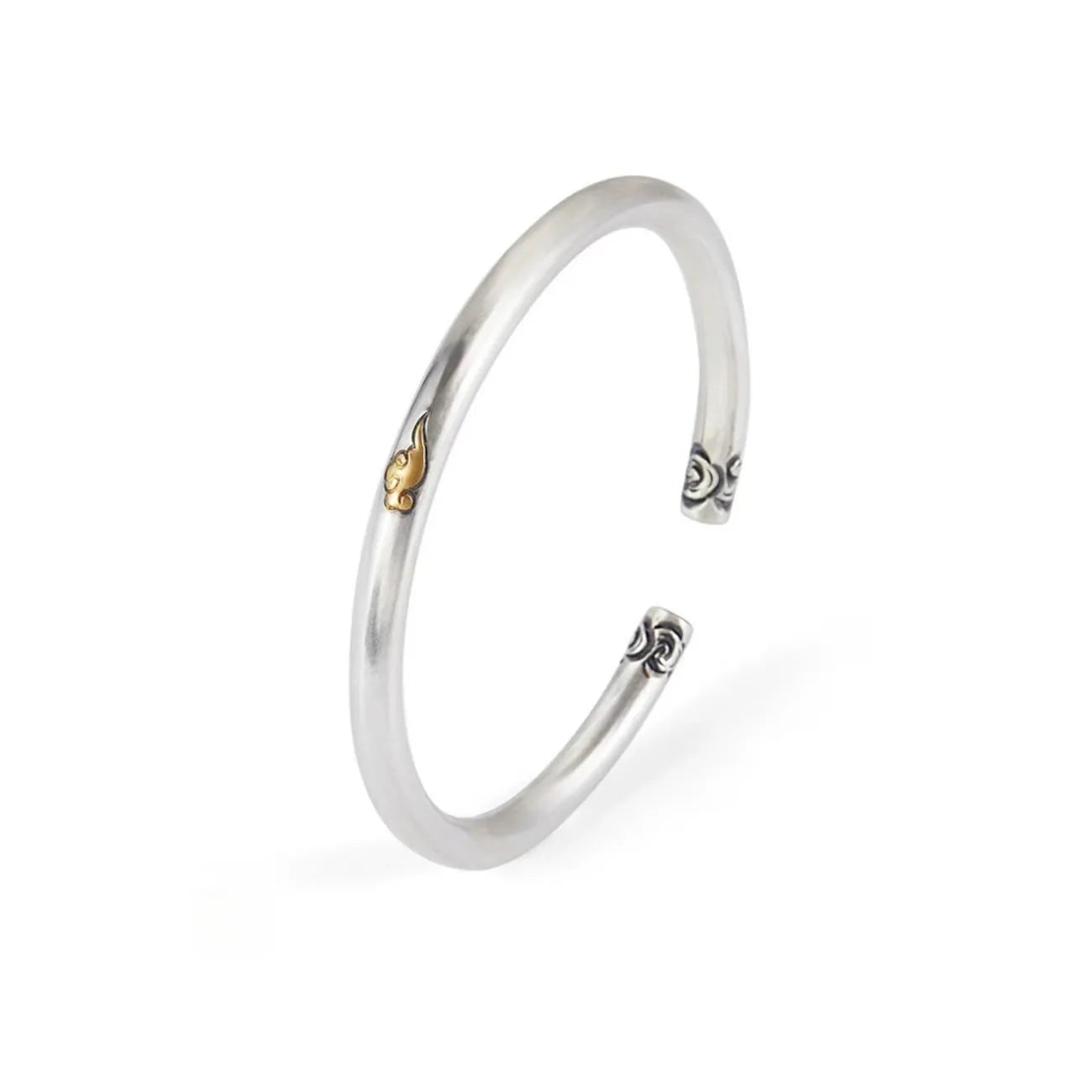 Side profile of the minimalist silver cuff, highlighting the smooth round curve and the subtle yet striking gold detail