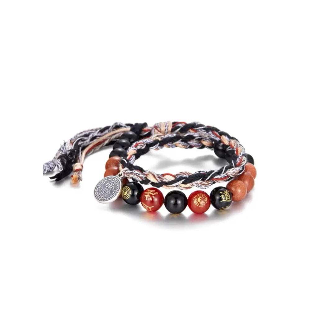 Front view of the double-layer Taoist bracelet, featuring a silver Yin Yang Bagua charm and a mix of obsidian and cinnabar beads